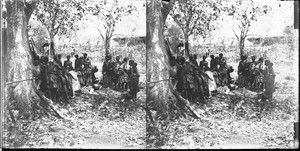 African people standing in the shade of a tree, Kouroulene, South Africa