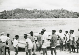 People going on board in a boat, in Gabon