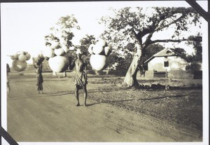 Carriers carrying pots