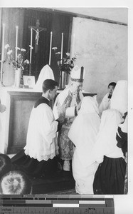 Bishop Raymond Lane conducting a ceremony at Fushun, China, 1940