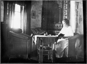 Mrs. Rohde in the living room of a European house, Boloti, Tanzania