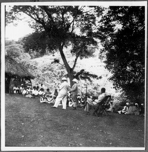 Missionaries Guth and Blumer(?) with audience, Tanzania, ca. 1927-1930