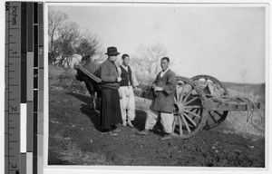 Reverend Carroll talks to two Korean men in Anshu, Korea, ca. 1930-1939