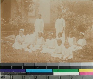 Antsirabe Hospital, patients and nurses gathered outside in the garden, Antsirabe, Madagascar, ca.1919