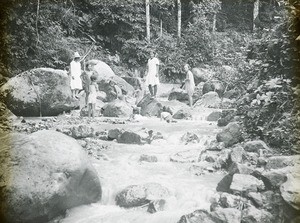 Girls on stepping stones and missionary, Peru, ca. 1947