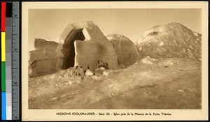 Mission igloo standing on a snowy rise, Canada, ca.1920-1940