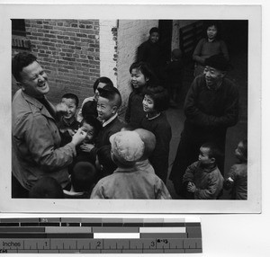 Rev. Lloyd Glass with children at Guilin, China, 1947
