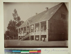 Knud and Franziska Lindoe on the porch of their home at the Theological Seminary Ivory, Fianarantsoa, Madagascar, ca.1902