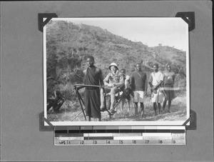 Missionary Giersch on a one-wheeled handcart, Tanzania, ca.1906-1929