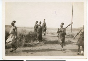 Six African women walking on a road, South Africa