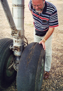 Inspection of the tires of the airplane by Lars Mandrup. 2001