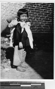 The first orphan received at Loting, China, 1921