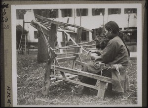 A blind girl weaving ribbons