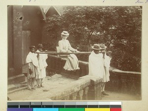 Kristine Stafseth being carried by filanjana, Antsahamanitra, Antananarivo, Madagascar, ca.1903