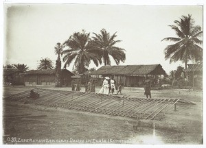 Putting a roof together in Duala, Cameroon