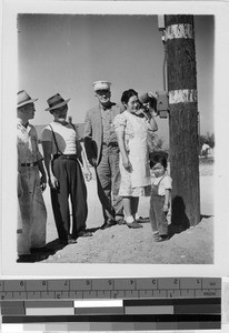 Using a call box to report a fire at Granada Japanese Relocation Camp, Amache, Colorado, ca. 1942
