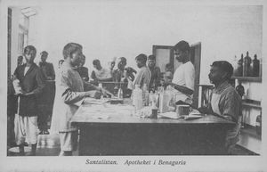 Post card with printed text: "Santalistan. The Pharmacy at Benagaria"