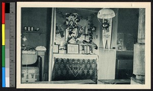 Table laden with religious materials, Alaska, ca.1920-1940