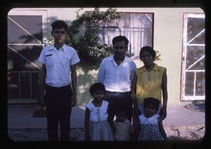 Family outside their home