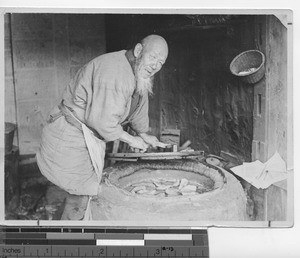 A man with sweet potatoes in China, 1932