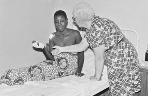 Missionary and Nurse, Ellen Margrethe Christensen with a patient at Izimbya Clinic, 1984. (Sent