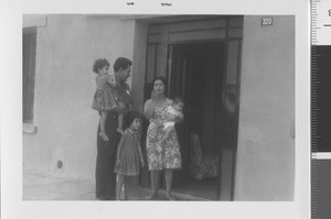 Family in front of home