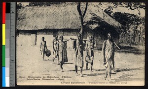 Women with digging sticks walking to work, French Equatorial Africa, ca.1920-1940