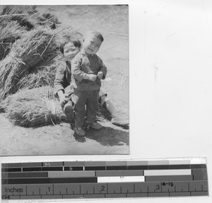 Two children pose for a picture at Chaoyangzhen, China, 1941