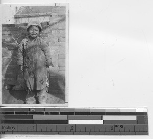 A child arrives at the mission at Xinbin, China, 1937