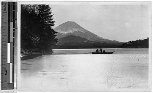 Three men in a boat on a lake near Mt. Fuji, Japan, ca. 1920-1940