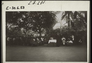 Preaching in the open-air before celebrating baptism in Ndogosimbi