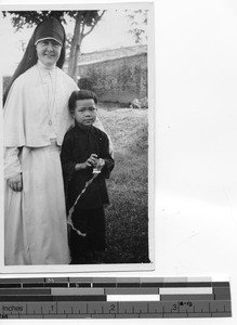 Sr. Colombiere with first communion child at Luoding, China, 1938