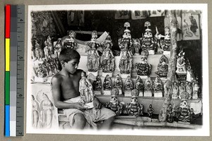 Boy in a Hindu idol shop, Vārānasi , India, ca. 1920