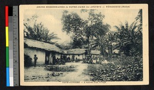 People gathered at the edge of a village, Cote d'Ivoire, ca.1920-1940