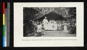 Missionary father performing Mass amid kneeling villagers, Angola, ca.1920-1940