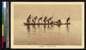 Men rowing a canoe, Zambia, ca.1920-1940