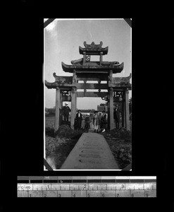 Missionaries standing under archway, Shantou, Guangdong, China, 1921