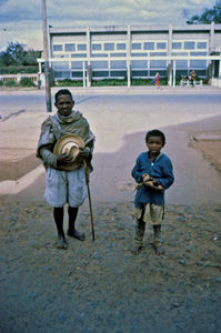 Mission at the bottom - City Mission in Madagascar. A grandfather with his grandson, working as