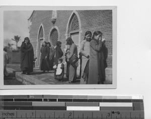 Maryknoll Sister with people of St. Joseph's church at Fushun, China, 1941