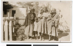 Three African women and three children in the garden, South Africa