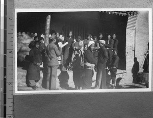 Villagers reading books brought by Harwood Bible Training School students, Fenyang, Shanxi, China, 1936