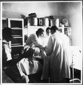 Dr. and Mrs. Mergner and Sister Jenny during an operation, Machame, Tanzania, ca.1927-1938