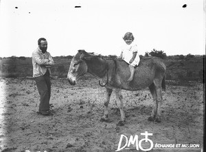 Little girl on donkey, Matutwini, Mozambique, ca. 1896-1911