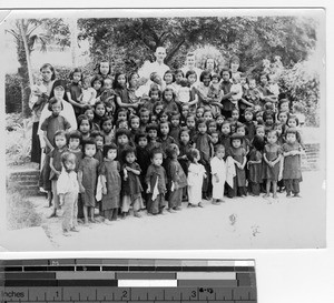 Maryknoll Sisters and priests at the orphanage at Luoding, China, 1946