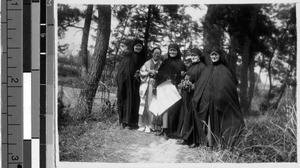 Maryknoll Sisters with preliminary plans for house, Kusatsu, Japan, April 7, 1938