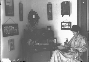 Female missionary at desk, Ricatla, Mozambique, ca. 1896-1911