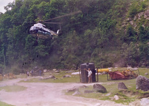 East Nepal, Khimti Hydropower Project, 1996. Helicopter transporting heavy goods further up the