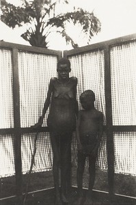 Pregnant young woman and boy, Nigeria, ca. 1932