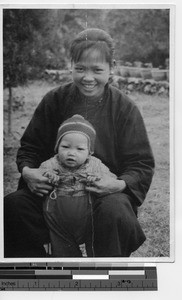 A young mother and child at Luoding, China, 1940