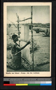 Woman weaving on an outdoor loom, Congo, ca.1920-1940